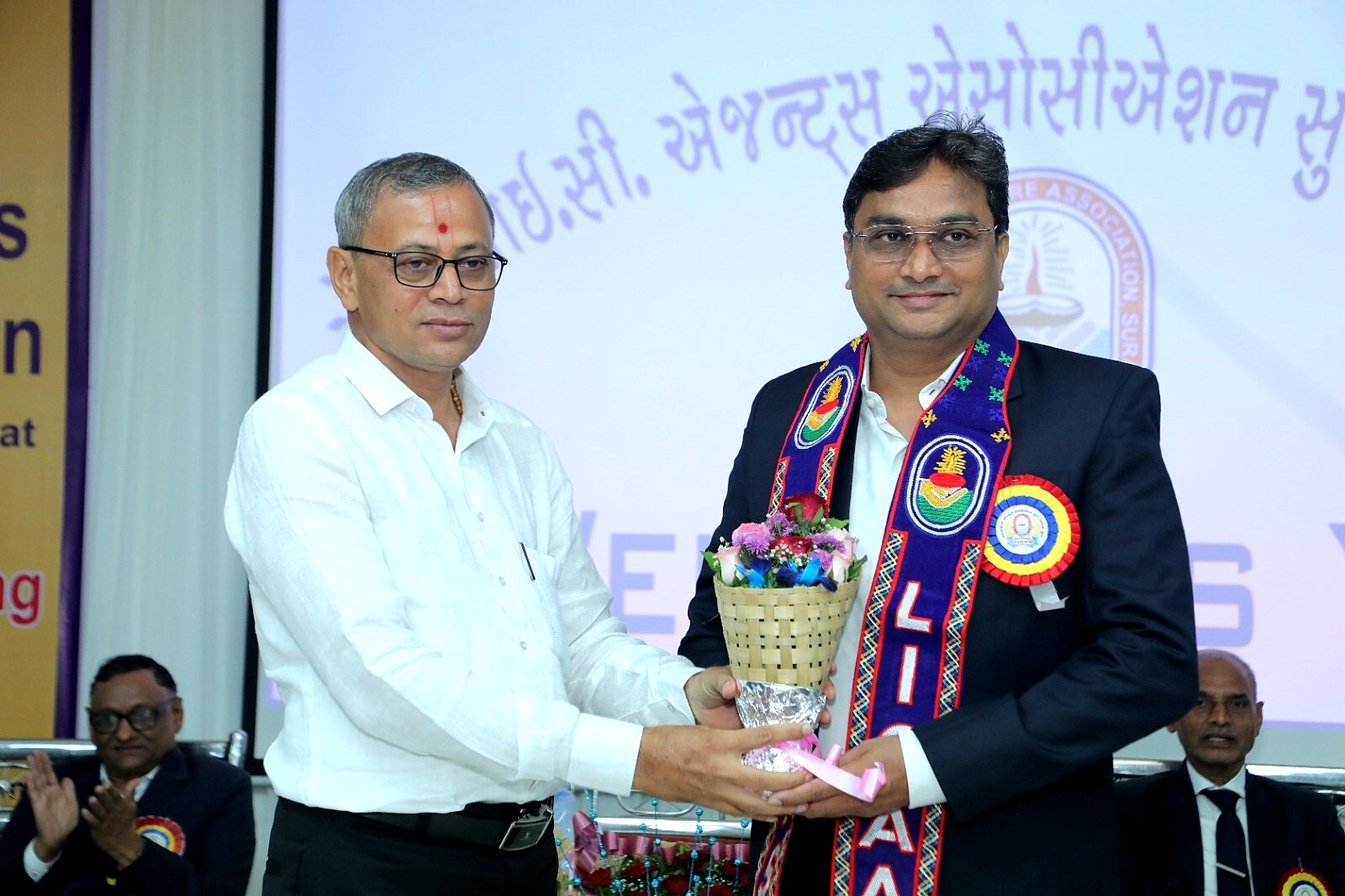 Member felicitation at LICAAS event